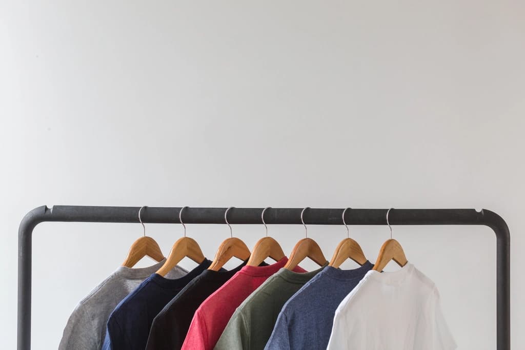 Clothes hanging in a wardrobe