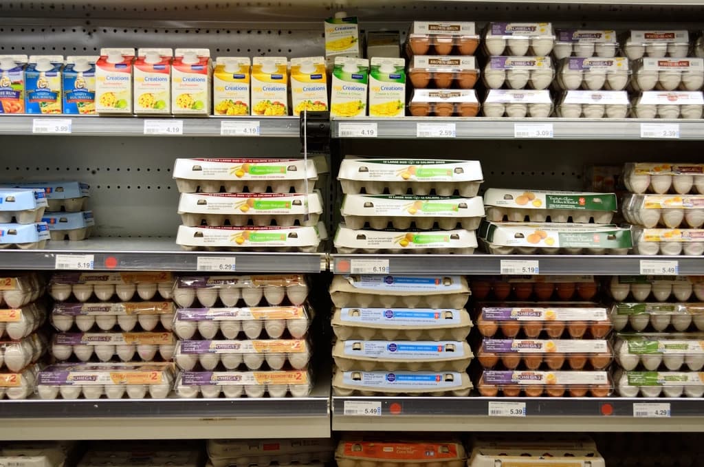 Packaged products lined up on a supermarket shelf