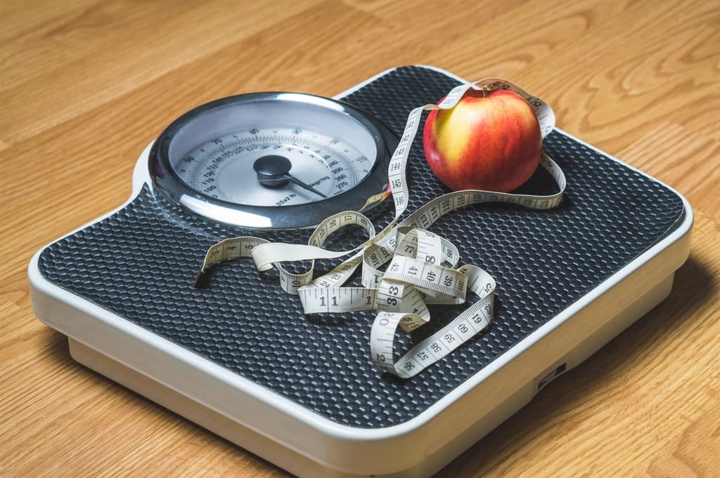 A weighing scale and a measuring tape