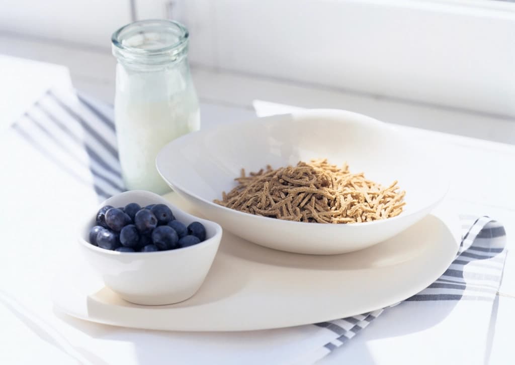 A bowl of oats and muesli with milk